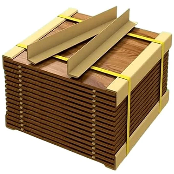 Kraft corner protectors on the edges of a strapped stack of wooden panels